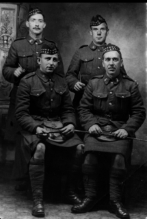 Burt Kennedy with 4 buddies. Dad lower left. Two look like horse soldiers.