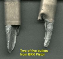 Different view of the two damaged bullets from Colt Revolver.