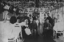 Hospital Picture showing Burt Kennedy sitting beside bed.