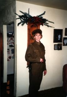 Deanna DiCola with Pistol as grandad would have worn it at time of gunshot wound.